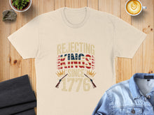 Load image into Gallery viewer, Cream t-shirt with "Rejecting Kings Since 1776" text and crossed flags.

