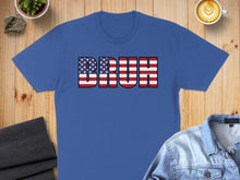 Load image into Gallery viewer, Blue t-shirt with "BRUH" in American flag lettering.
