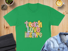 Load image into Gallery viewer, Green t-shirt with colorful "Teach Love Inspire" text and flowers.
