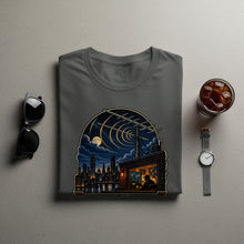Load image into Gallery viewer, Gray t-shirt featuring a rooftop broadcast scene overlooking a city at night.
