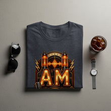 Load image into Gallery viewer, Dark gray t-shirt with "AM" graphic featuring vintage radio tubes and a microphone.
