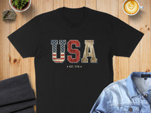 Load image into Gallery viewer, Black t-shirt with "USA EST. 1776" in distressed flag and city graphics.
