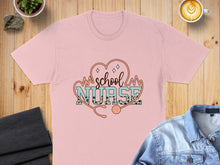 Load image into Gallery viewer, Pink t-shirt with "school nurse" text and stethoscope graphic.

