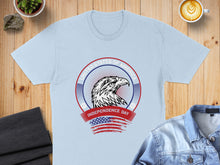 Load image into Gallery viewer, Light blue t-shirt featuring an eagle and "United States of America Independence Day" text.

