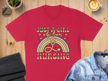 Load image into Gallery viewer, Red t-shirt with rainbow stethoscope and "Just a girl who loves nursing" text.
