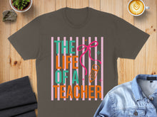 Load image into Gallery viewer, T-shirt with "The Life of a Teacher" text, pencil, and pink bow.

