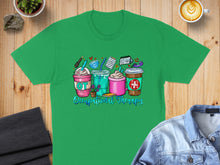 Load image into Gallery viewer, Green t-shirt with colorful occupational therapy drinks and icons.

