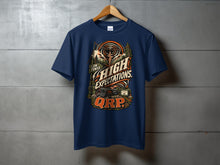 Load image into Gallery viewer, Navy t-shirt with "Low Power, High Expectations. QRP." graphic.
