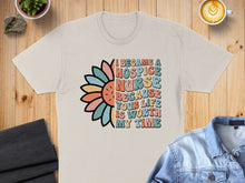 Load image into Gallery viewer, Beige t-shirt with "I became a hospice nurse because your life is worth my time" text and floral graphic.
