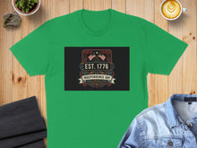Load image into Gallery viewer, Green t-shirt featuring an "Est. 1776 Independence Day" graphic with American flags.
