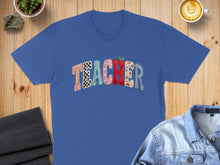 Load image into Gallery viewer, Blue t-shirt with "TEACHER" in colorful, patterned letters.
