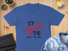 Load image into Gallery viewer, Blue t-shirt with "1776 America Land of the Free" graphic.
