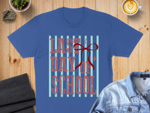Load image into Gallery viewer, Blue t-shirt with red text "LAST DAY OF SCHOOL" and a red bow.
