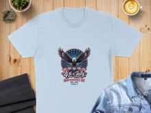 Load image into Gallery viewer, Light blue t-shirt with eagle, fireworks, and "4th of July Est. 1776 U.S.A." text.

