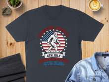 Load image into Gallery viewer, Bigfoot celebrating Fourth of July with US flag and text.
