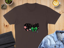 Load image into Gallery viewer, Brown t-shirt with "Nurse" text, stethoscope, and floral accents.
