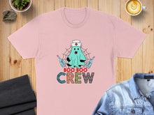 Load image into Gallery viewer, Pink t-shirt with a cartoon ghost nurse and the words "Boo Boo Crew".
