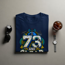 Load image into Gallery viewer, Navy t-shirt with "73 AND" design featuring radio tower, globe, and meters.
