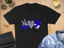 Load image into Gallery viewer, Black t-shirt with blue leopard print peace sign, heart, and syringe, reading "Peace love phlebotomy".
