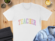 Load image into Gallery viewer, White t-shirt with "TEACHER" in pastel rainbow letters.
