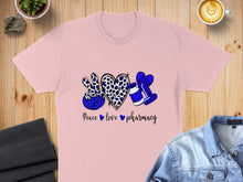 Load image into Gallery viewer, Pink t-shirt with "Peace love pharmacy" text and leopard print peace sign.
